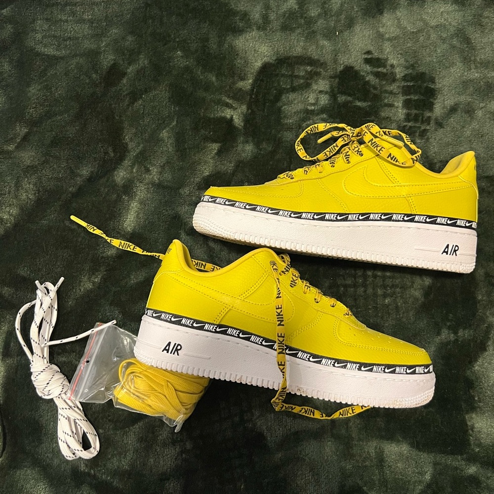 Woman’s size 8 Nike Air Force 1 low over branding yellow